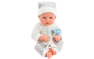 Baby doll in white and gray striped clothes, hat, pacifier, quilt