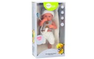 Baby doll in white and gray clothes, hat, pacifier, and blanket
