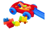 Set of blocks in a blue and red wheeled cart