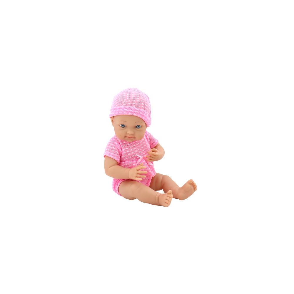 Baby doll in pink clothes, hat, pacifier, and blanket