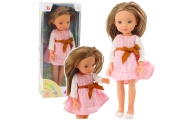 Doll in a pink dress with a bow, long brown hair